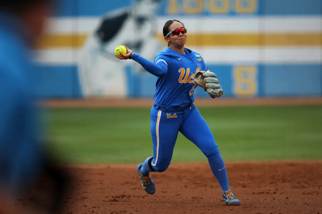 UCLAâs Bri Alejandre tosses the ball to first base during...