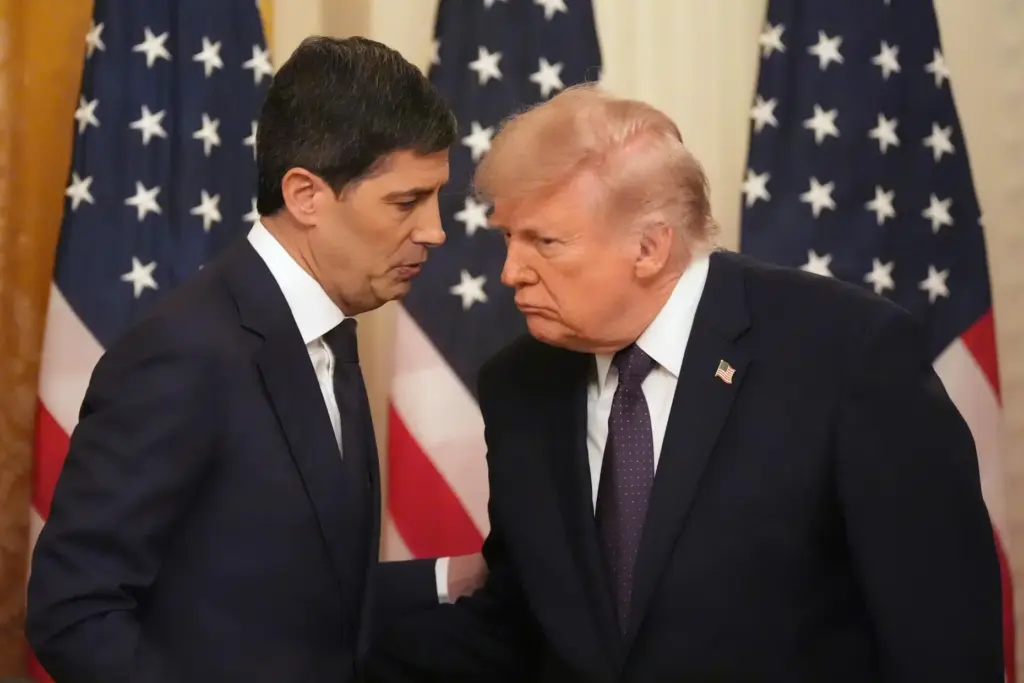 President Donald Trump, right, speaks with Federal Reserve Chairman Kevin Warsh
