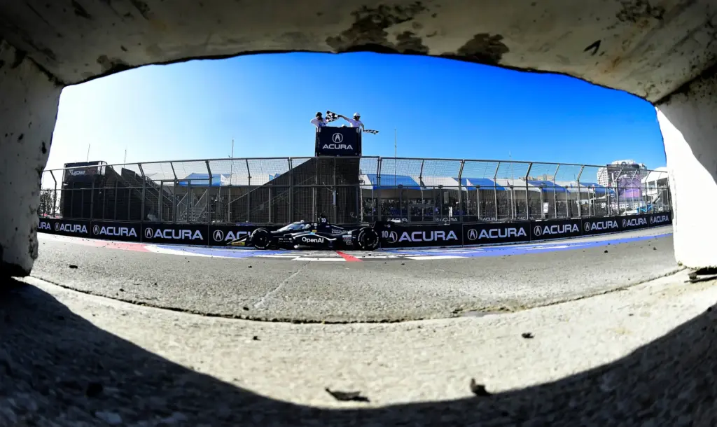 Indycar driver Alex Palou takes the checkered flag to win...