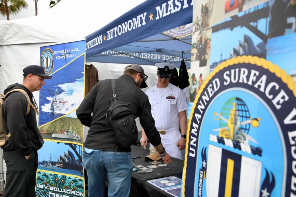 Attendees have the opportunity to chat with military personnel on...