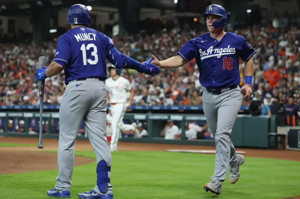 The Dodgers’ Will Smith, right, is congratulated by teammate Max...