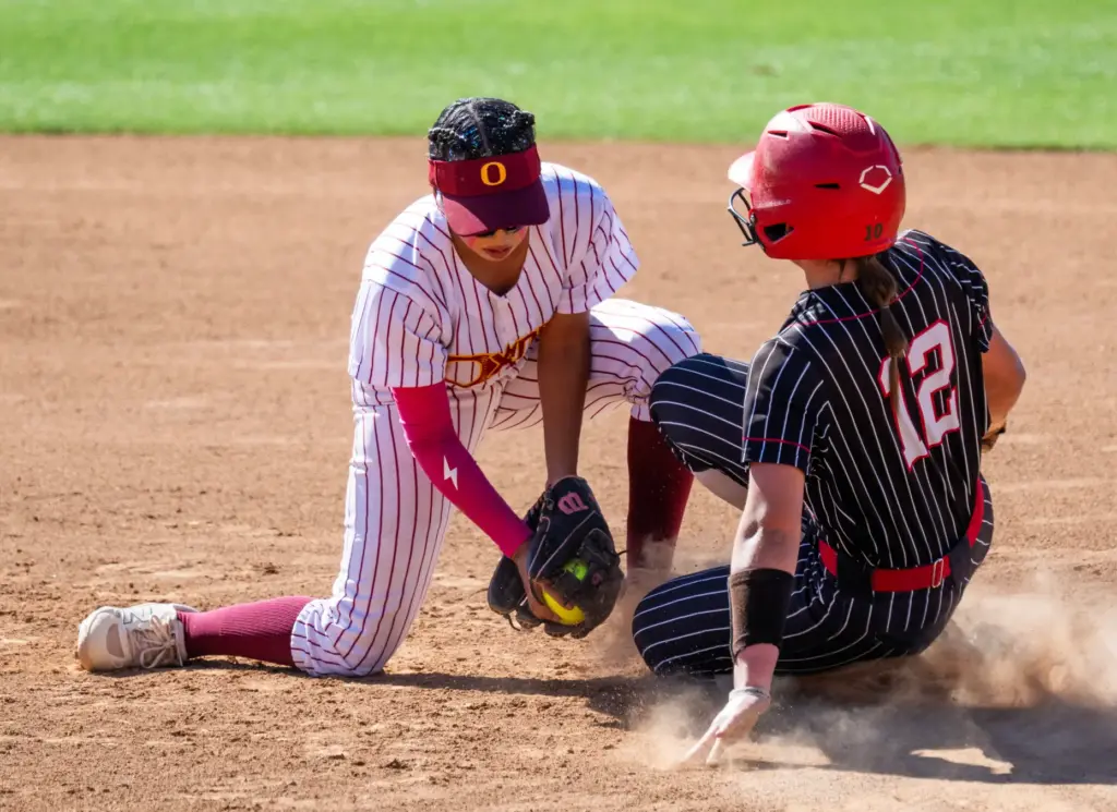 Oxnard shortstop Kayla Lorona tags out Mission Viejo third baseman...