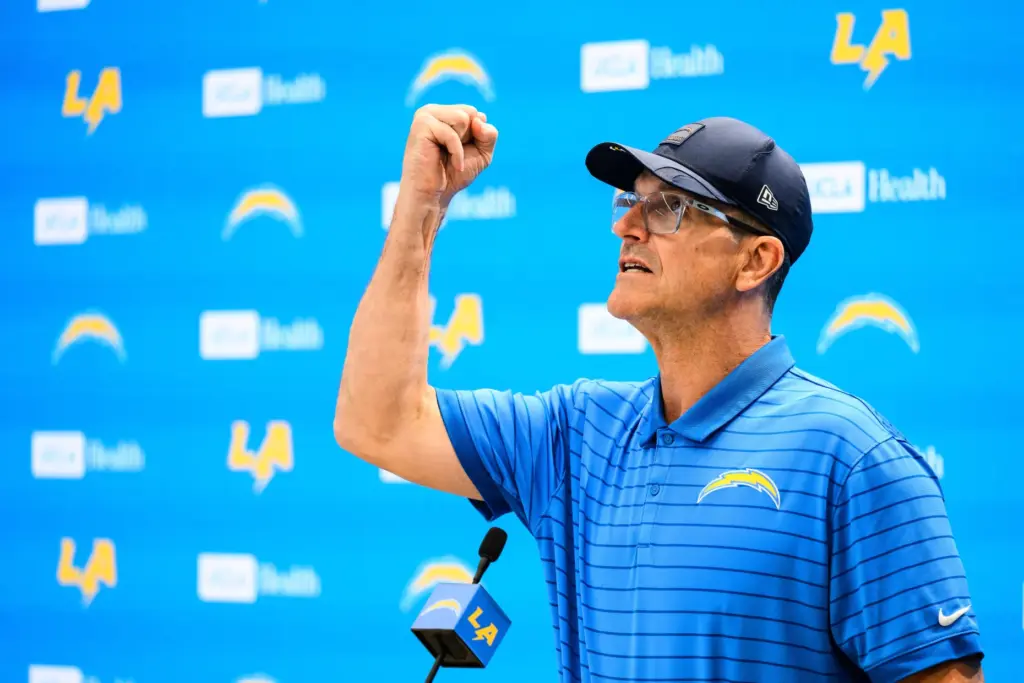 Chargers head coach Jim Harbaugh speaks to reporters before the...