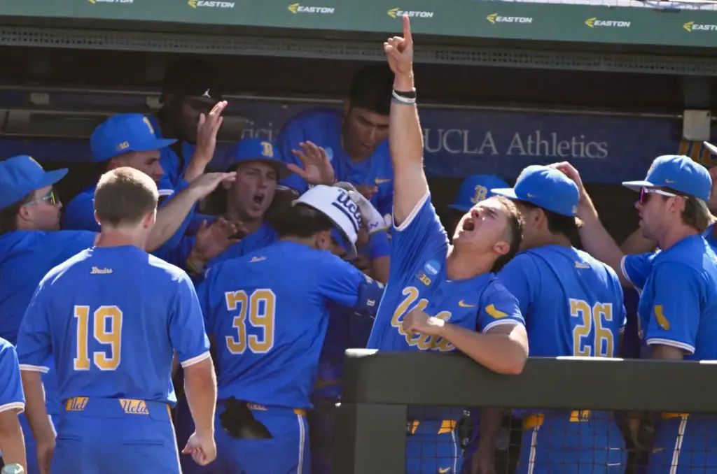 Mulivai Levu #39 of the UCLA Bruins celebrates with teammates...