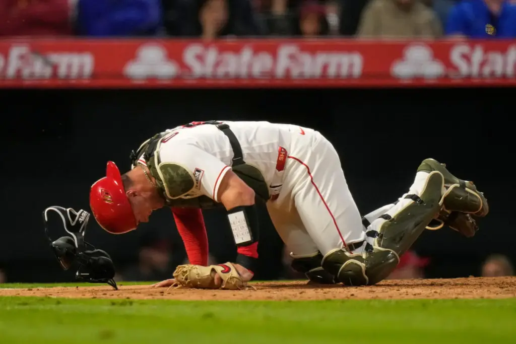 Angels catcher Logan O’Hoppe crawls around home plate after being...