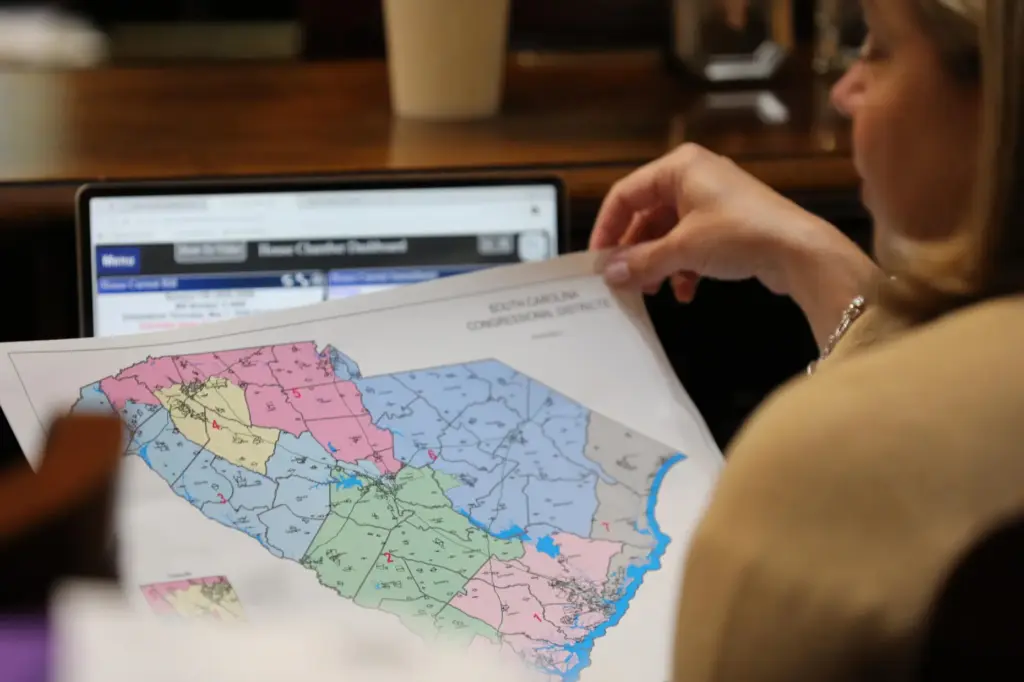Republican South Carolina Rep. Jackie Terribile looks at a proposed map of new U.S. House districts.