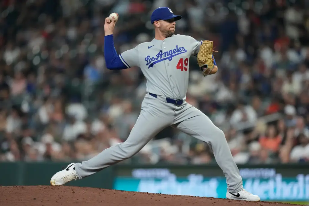 Dodgers relief pitcher Blake Treinen throws to the plate during...