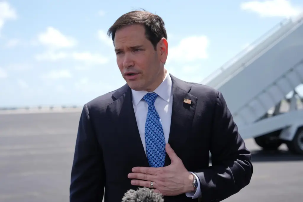 Secretary of State Marco Rubio speaks to the press before boarding his plane.