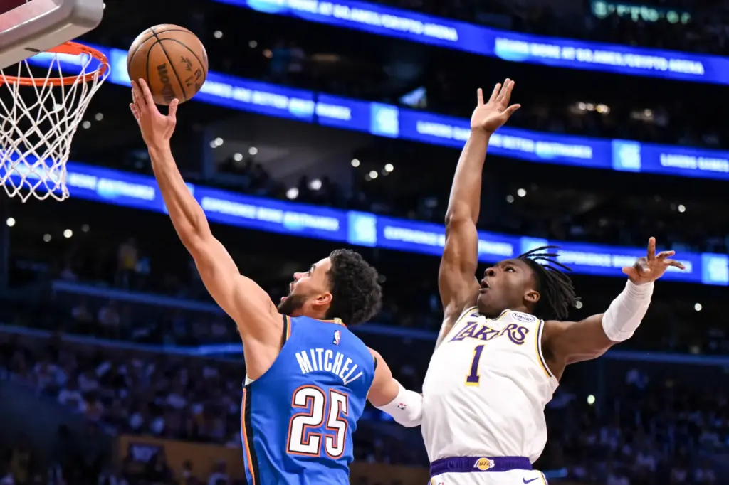 The Oklahoma City Thunder’s Ajay Mitchell, left, gets to the...