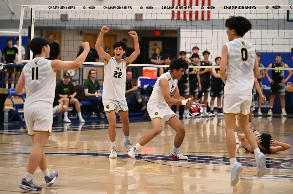Owen Filadelfia #22 of the Sunny Hills Lancers along with...