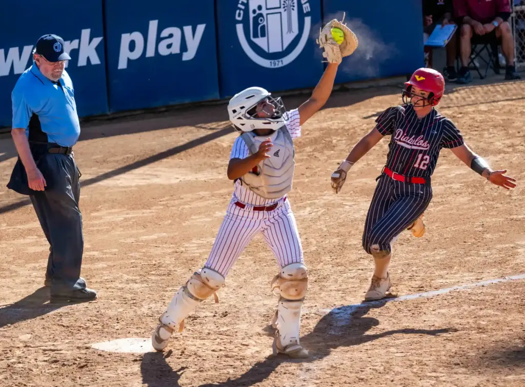 Oxnard catcher Valentina Garcia catches the ball in time to...