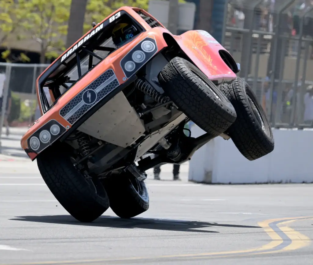 Stadium Super Trucks race winner Matt Brabham gets up on...
