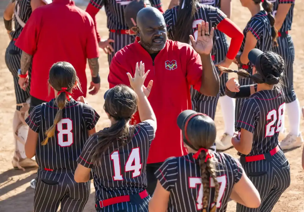Mission Viejo assistant coach Skeats Spalding high fives his players...