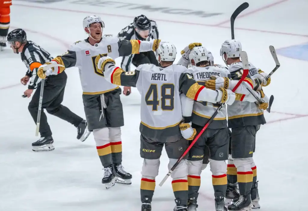Vegas Golden Knights players celebrate a goal by Shea Theodore...