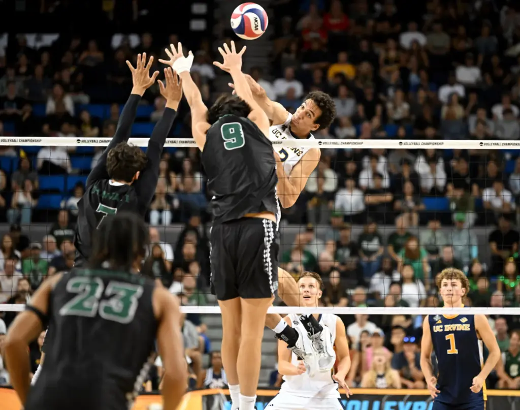 Hawaii players defend against a spike by UC Irvine’s Trevor...