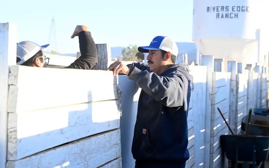 Riverâs Edge Ranch yard boss Rodney Mora, right, speaks with...