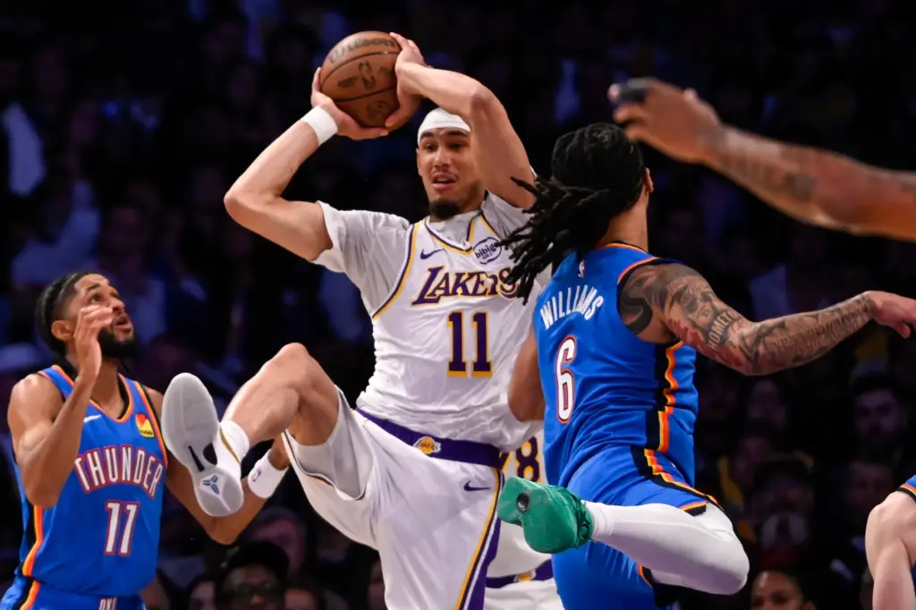 Lakers center Jaxson Hayes grabs a rebound as the Oklahoma...