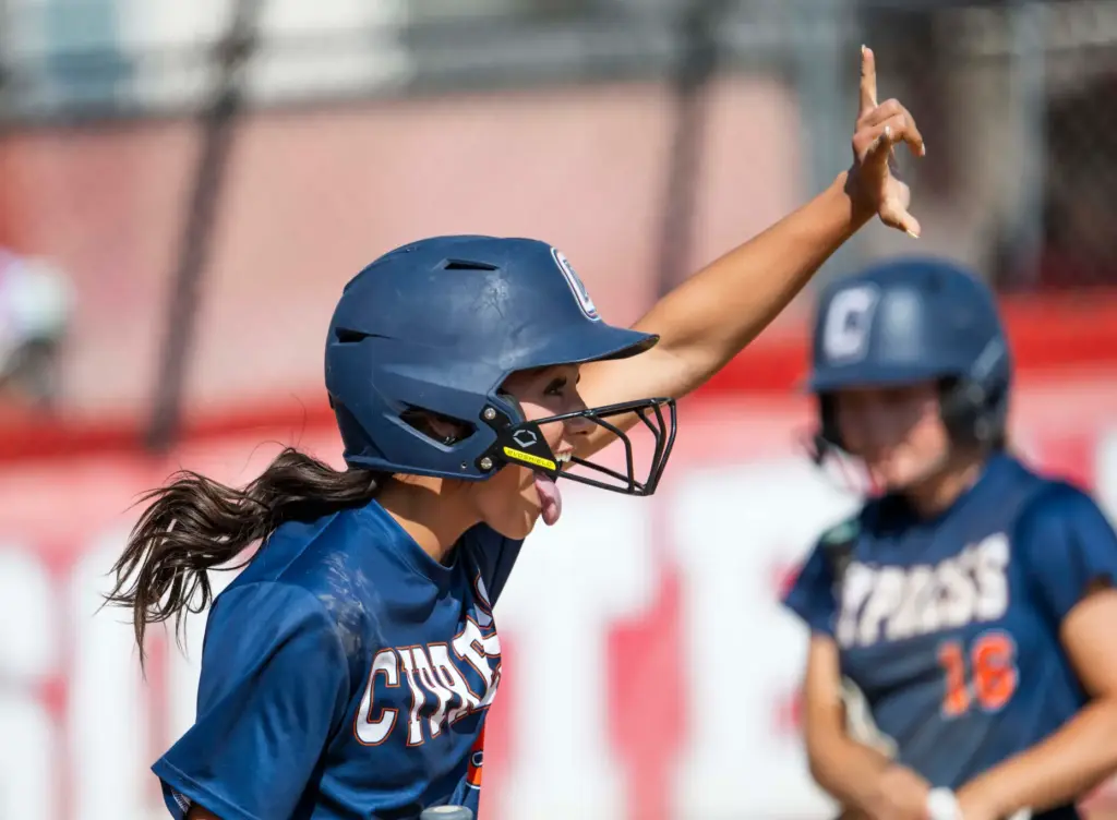 Cypress’ Morgan Anderson signals to a teammate after scoring a...