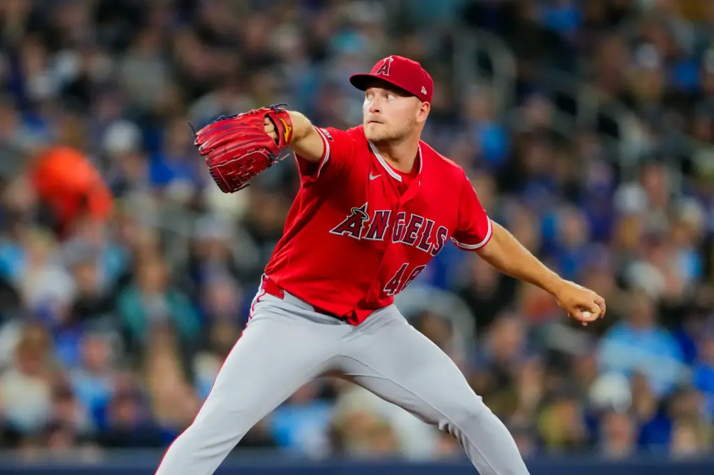 Angels starting pitcher Reid Detmers throws to the plate during...