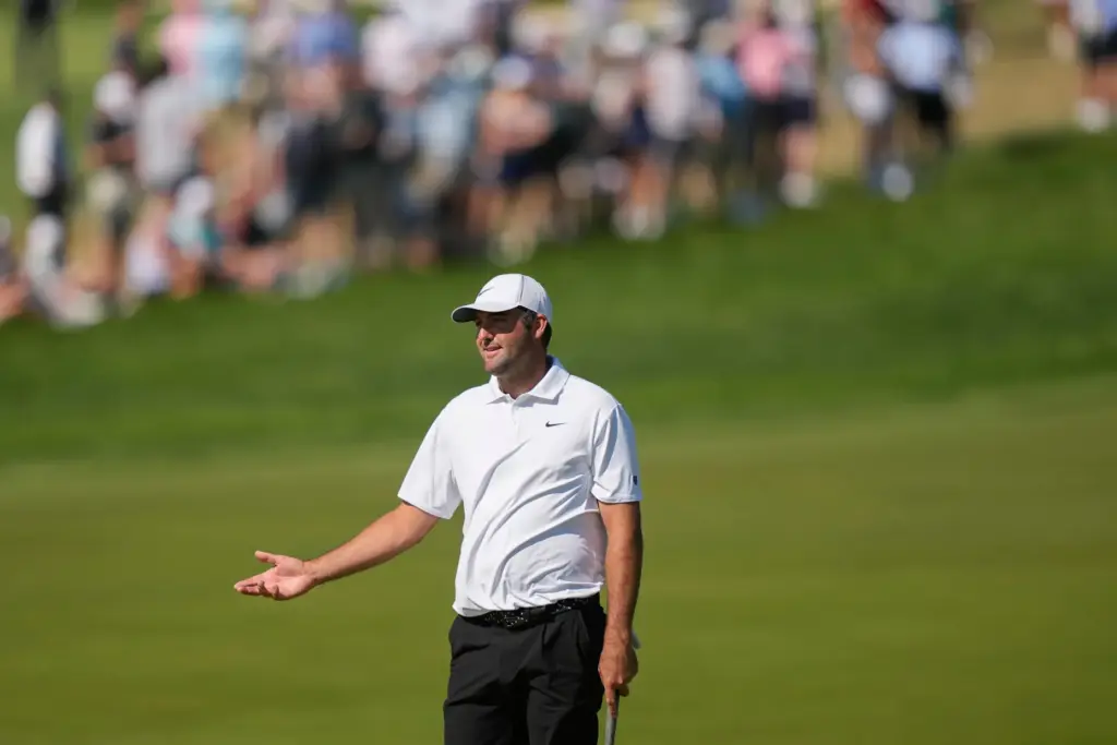 Scottie Scheffler reacts to a missed shot on the 10th...