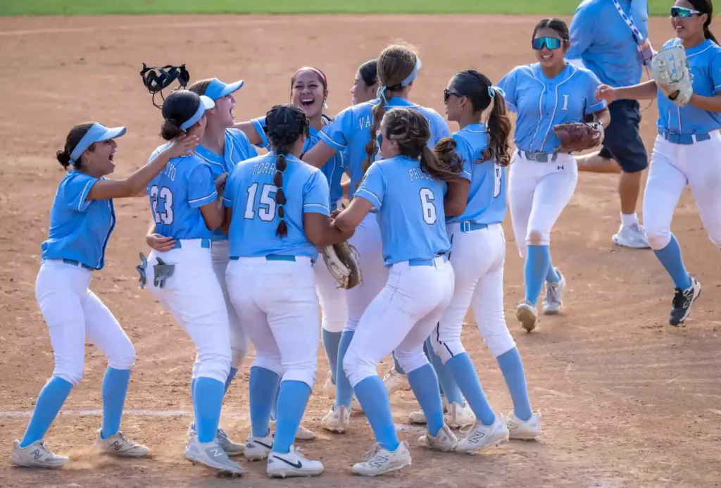 Irvine players celebrate the teamsâ 15-2 win over Arroyo during...