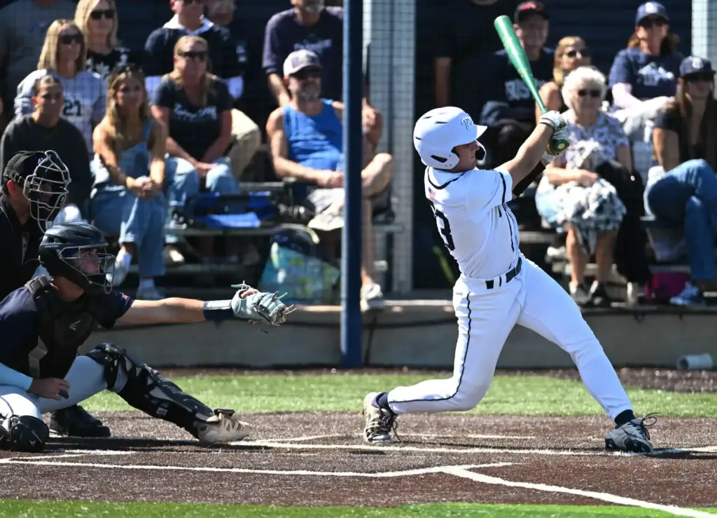 Cameron Hatfield (33) of Newport Harbor hits in two runs...