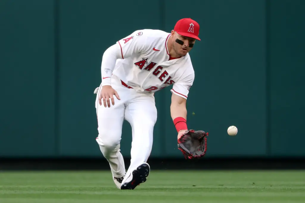Angels center fielder Mike Trout fields a ball during the...