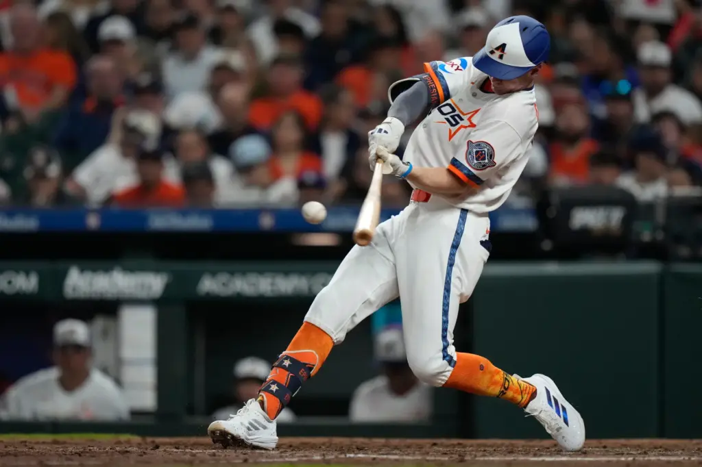 The Houston Astros’ Zach Cole hits a solo home run...