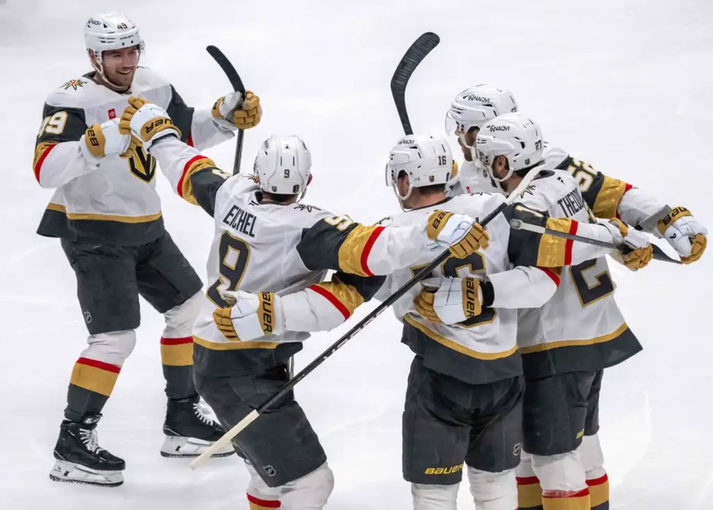 Vegas Golden Knights players celebrate a goal by Pavel Dorofeyev...