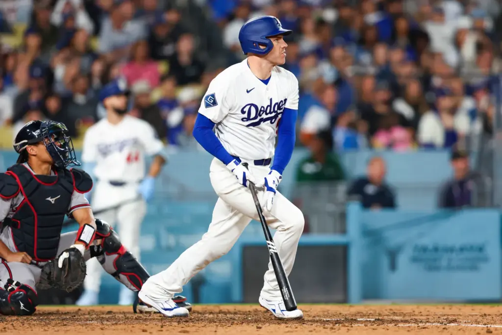 The Dodgers’ Freddie Freeman watches the flight of his solo...