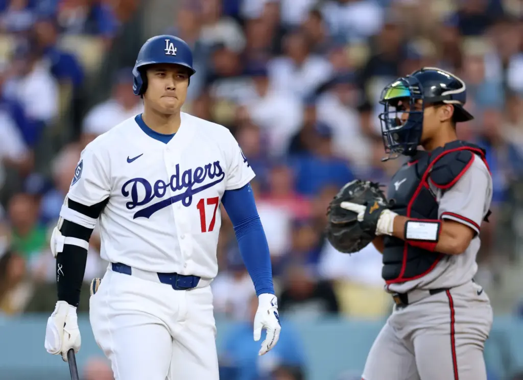 Dodgers star Shohei Ohtani shows his frustration as he walks...