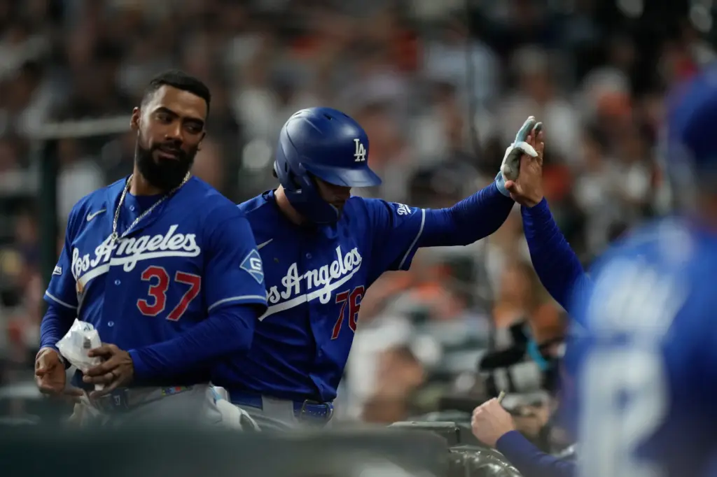The Dodgers’ Alex Freeland (76) returns to the dugout next...