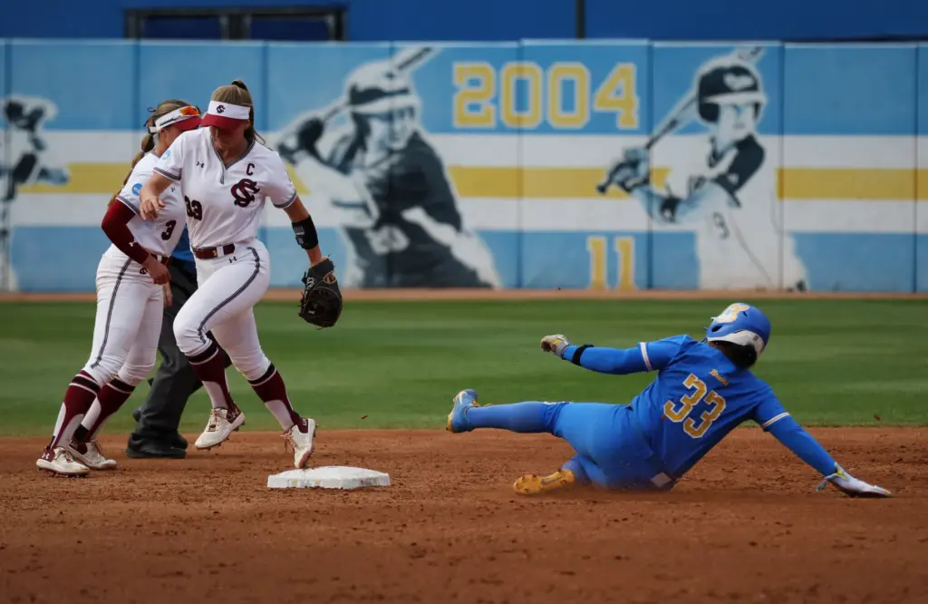 South Carolinaâs Karley Shelton steps on the bag to force...