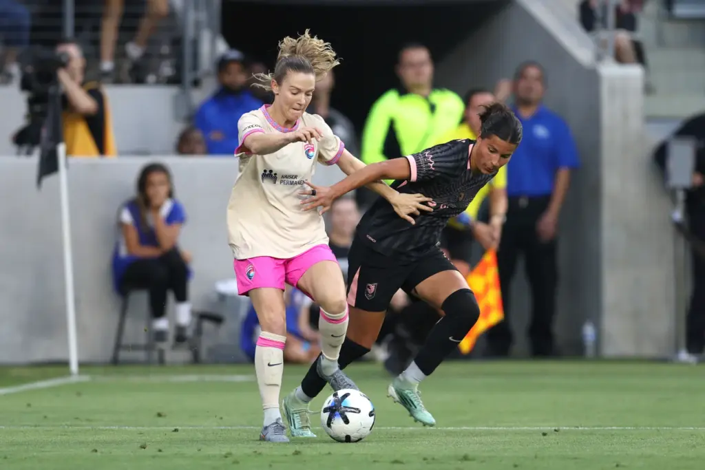 Angel City FC defender Emily Sams, right, vies for the...