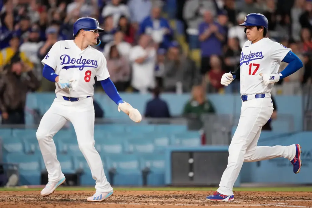 The Dodgers’ KikÃ© HernÃ¡ndez, looks back at Shohei Ohtani as...