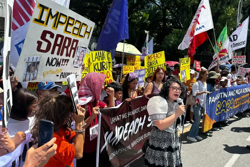 Protesters shout slogans during a rally calling for the impeachment...