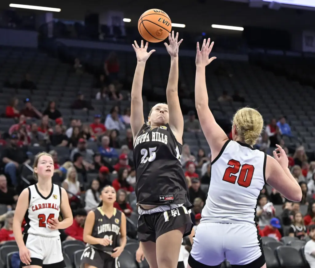 Meghan Rehmeier #25 of Laguna Hills Shoots over Siena Sorbello...