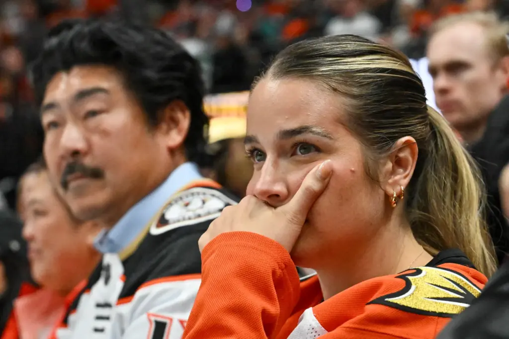 A Ducks fan watches during the final minutes of their...