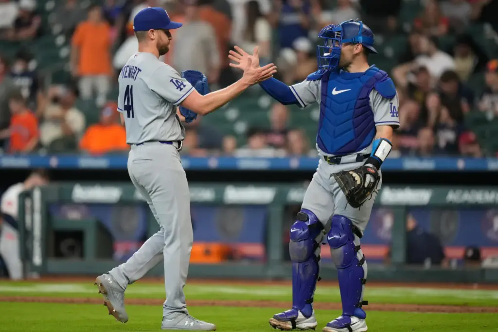 Dodgers relief pitcher Brock Stewart, left, celebrates with catcher Dalton...