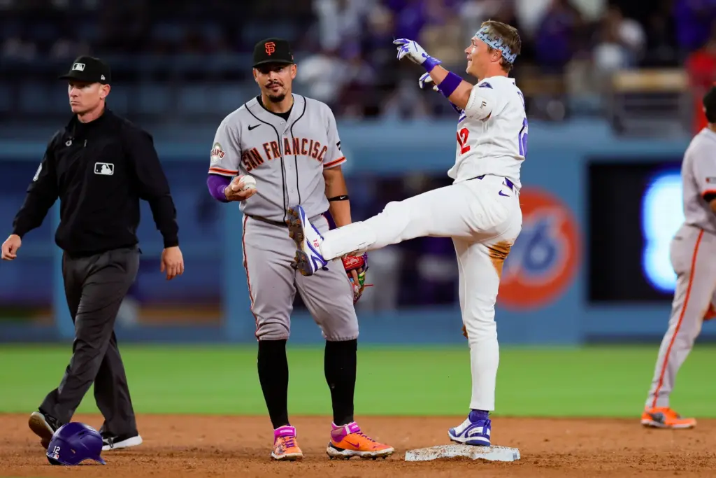 The Dodgers’ Alex Call, right, celebrates near San Francisco Giants...