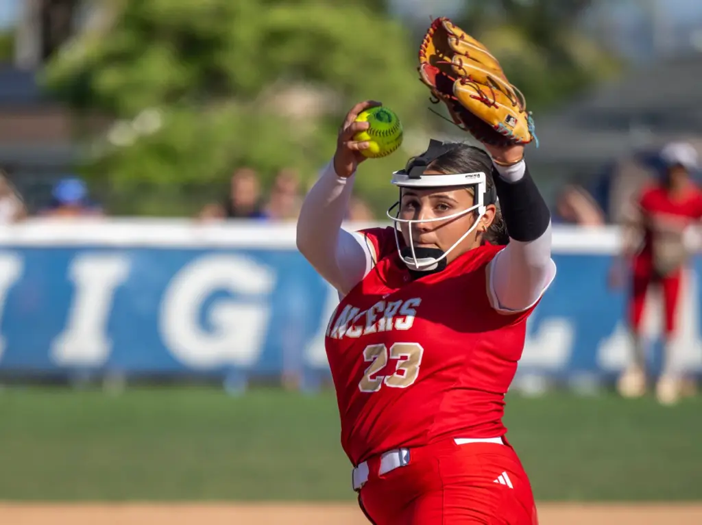 Orange Lutheran relief pitcher Jo Marsh throws to home plate...