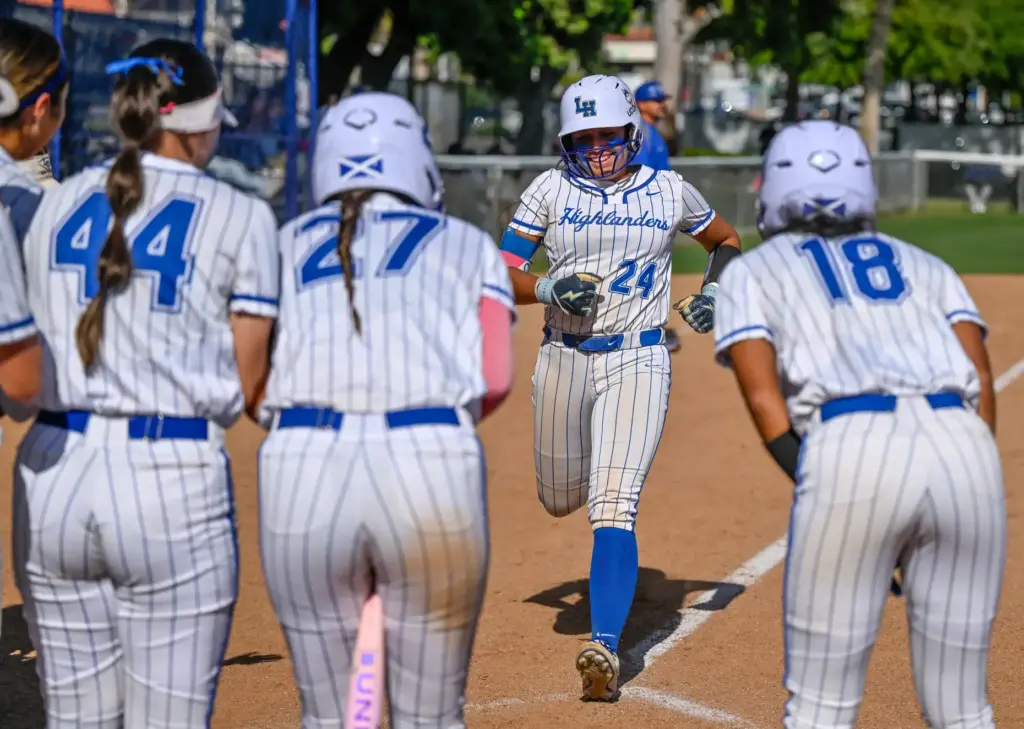 La Habra players welcome Mireya Gonzalez back to home plate...