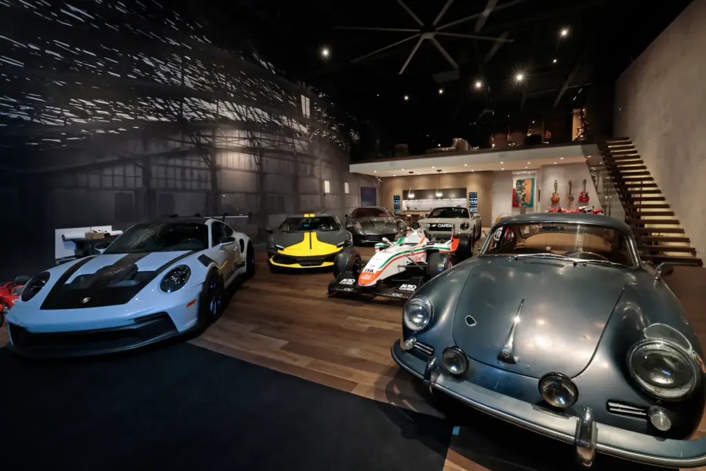 Luxury and race cars are shown inside of CEO and...