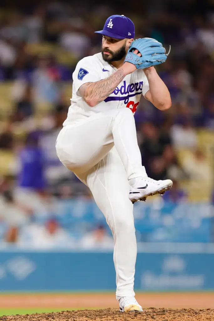 Dodgers relief pitcher Tanner Scott throws to the plate during...