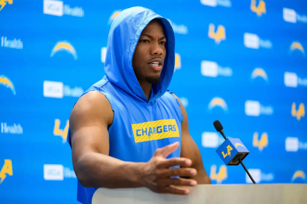 Chargers linebacker Daiyan Henley speaks to reporters after the team’s...