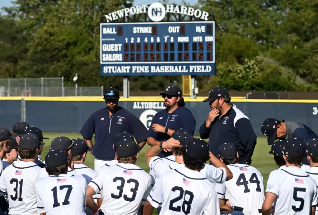 With the final scoreboard reading 15-1 behind them, Newport Harbor...