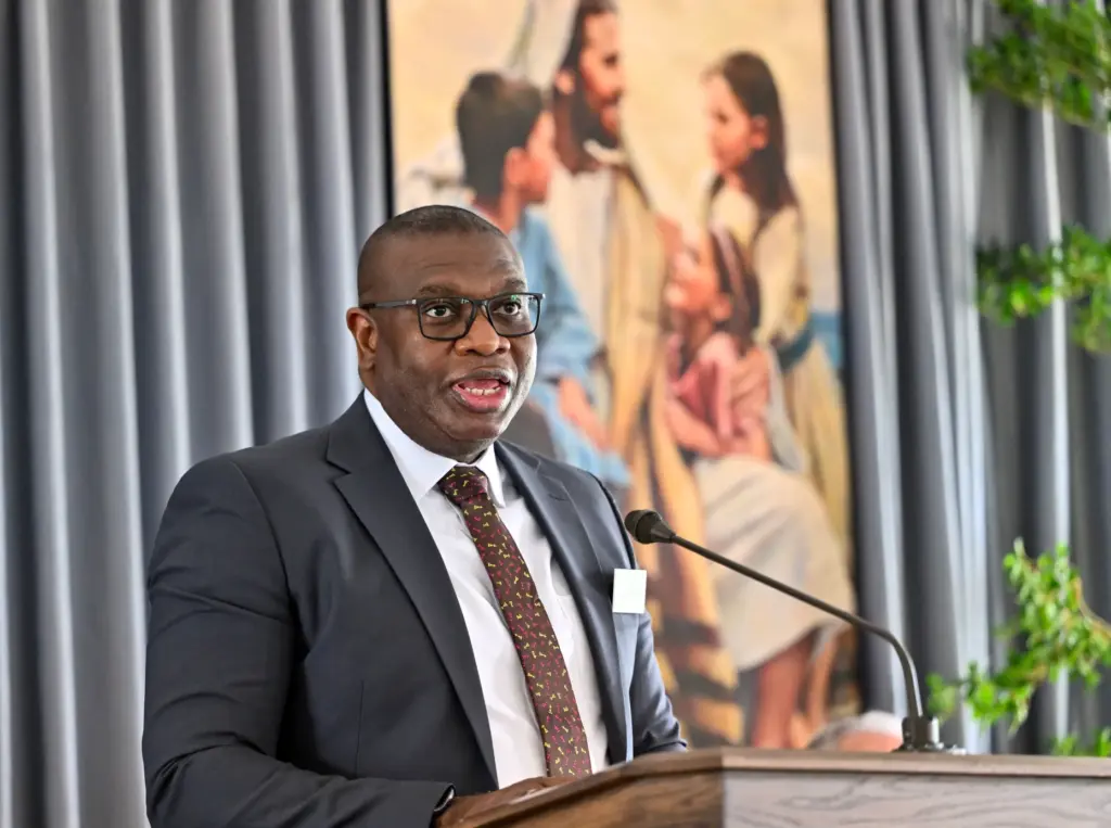 Elder Raymond Egbo speaks during a briefing before the open...