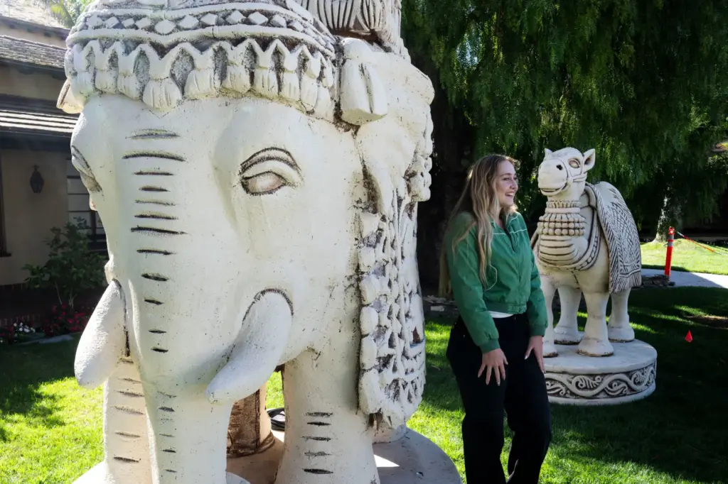 Alexandria Trudgen takes a photo in front of a giant...