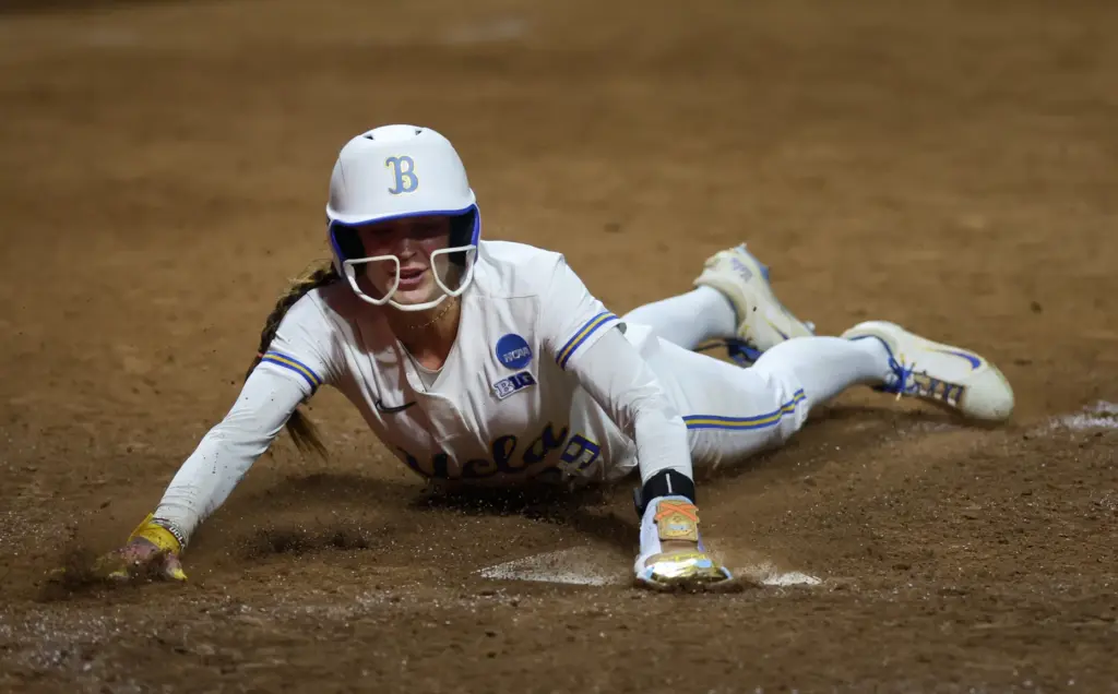 UCLAâs Rylee Slimp slides home to score the game-winning run...