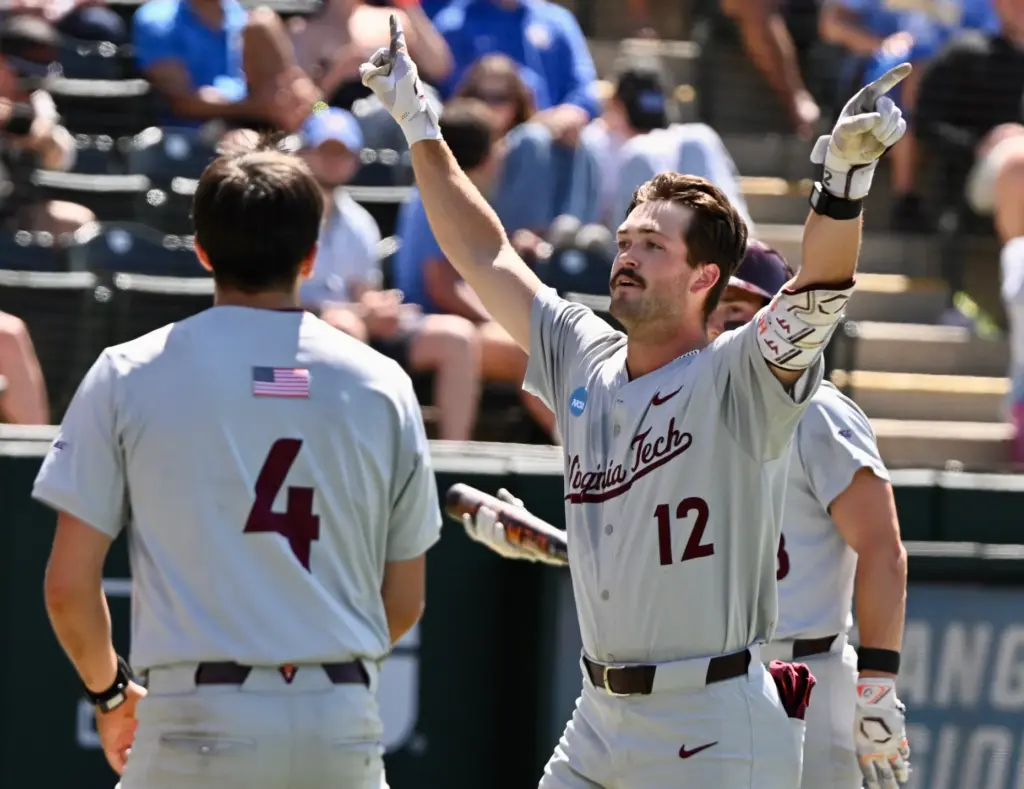 Ethan Gibson #12 of the Virginia Tech Hokies reacts after...